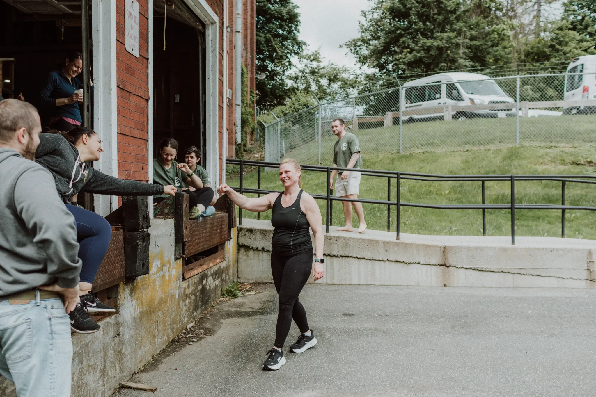 Woman running outdoors at Evolved CrossFit